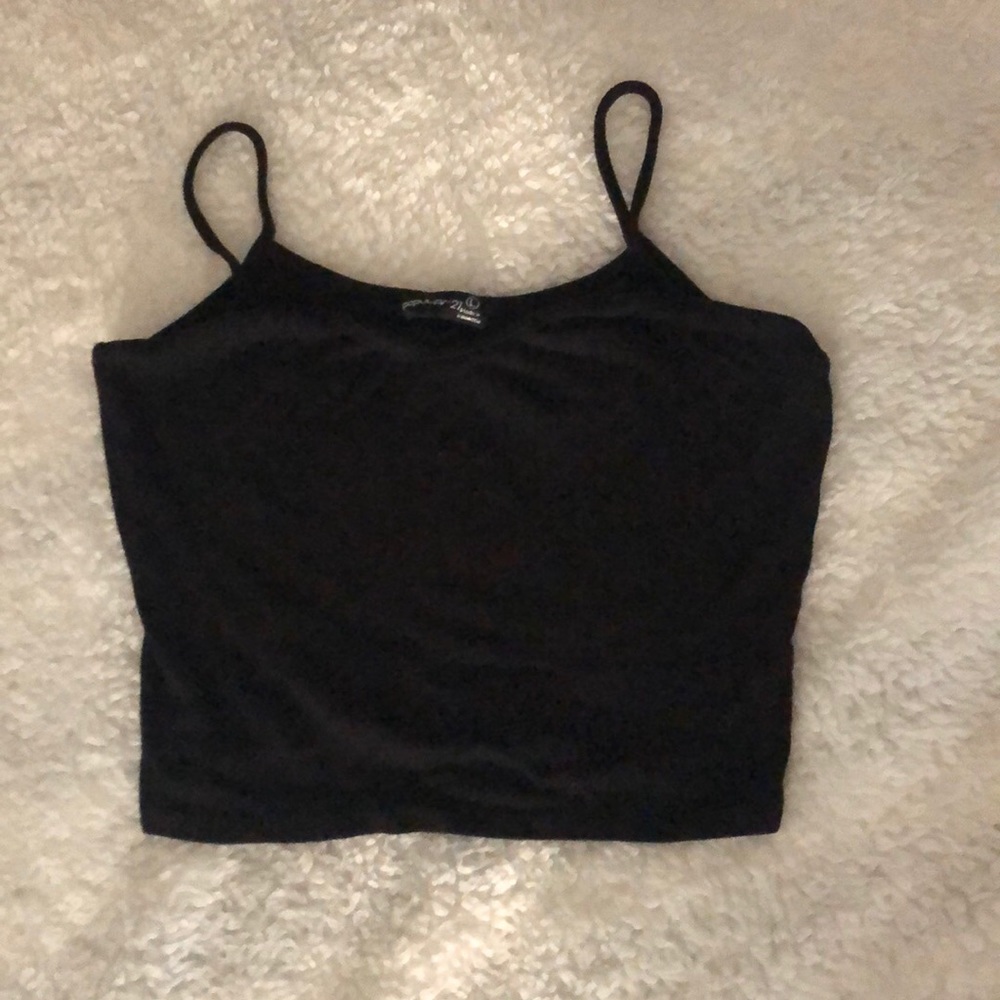 Black top with spaghetti straps size L stretches.